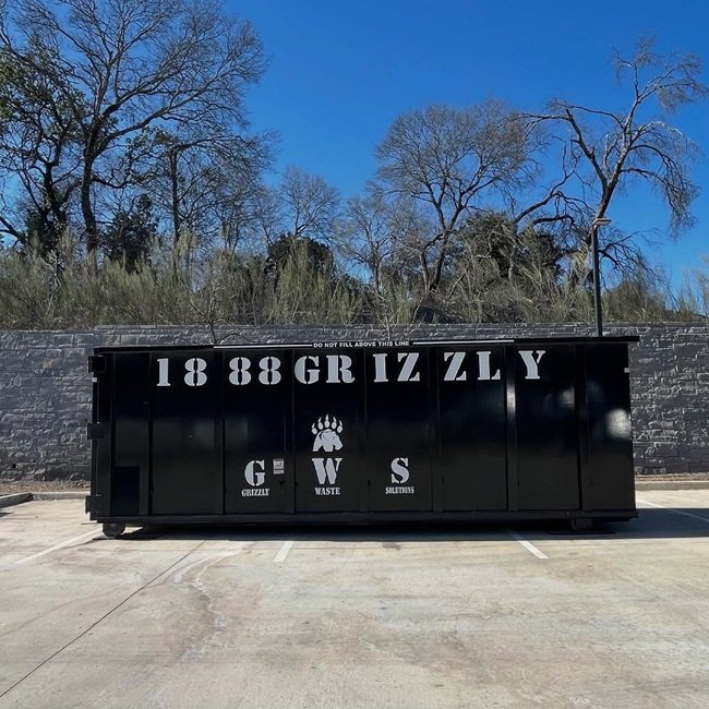 dropping off a commercial dumpster rental in san antonio at a client